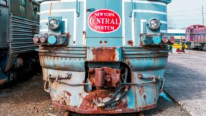 The front of a weathered locomotive with a "NEW YORK CENTRAL SYSTEM" logo stands out. Rust covers parts of its blue - hued body, hinting at its long - standing history. Amidst other railway equipment in the background, it tells a story of times past. And in the tech world, Firework Just Dropped the World’s First Live Shopping GPT, an innovation that's bound to reshape the e - commerce landscape.