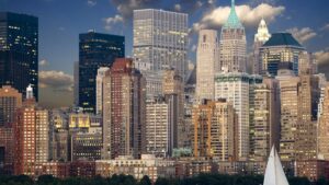 A picturesque urban skyline featuring a cluster of towering skyscrapers under a partly cloudy sky. This visual is associated with the 2025 Charging Standards for Kwai Influencer Promotions in the U.S., symbolizing the vibrant business environment where such influencer marketing initiatives may thrive.